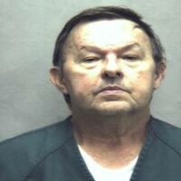 Julian Lee “Buzz” Burke is charged in the shooting death of a store owner.