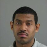 Harvey Newman, 37, is charged with possession of a firearm by a convicted felon. (Submitted)