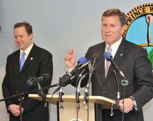 Virginia Transportation Secretary Sean Connaughton stands with Prince William Board of Supervisors Chairman Corey Stewart to announce 1,000 new commuter parking spaces will be built at the Horner Road Commuter lot. (File photo: Mary Davidson/PotomacLocal.com)