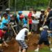 Children, along with county and park officials, break ground at what will be a redesigned skate park at Veterans Park in Woodbridge. (Submitted photo)