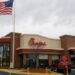 Road delineator posts erected in the drive-through lane at the Chick-fil-A restaurant in Woodbridge forces drivers to circle the building before they can enter the lane to order food from their vehicles.