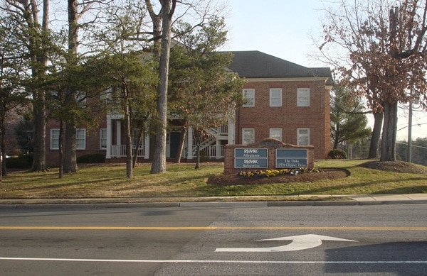 The Oaks I and II office buildings sit at the corner of Old Bridge Road and Clipper Drive in Lake Ridge. Occoquan Town officials want the complex’s developers to address water runoff issues from the buildings that have plagued the town in recent months before construction on a planned Oaks III office building begins. (Uriah Kiser/PotomacLocal.com)
