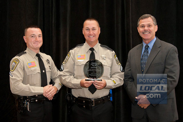 Stafford County Sheriff Charles E. Jett, Master Deputy Mike Powell and Deputy First Class Jason Forman accept a first place traffic safety award from the Virginia Association of Chiefs of Police.