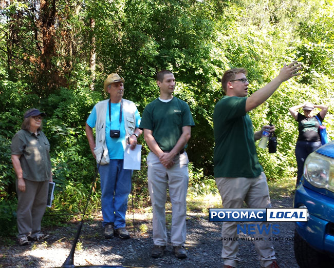 Ryan Conklin, a planner with the Prince William Parks and Recreation Department, shows where a parking lot for a new Dove’s Landing Park could be located. [Uriah Kiser / Potomac Local News]