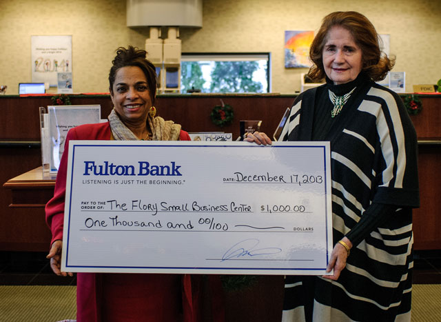 Nury Mena, Branch Manager for Fulton’s Manassas Branch, presented the check to Flory Small Business Centre President Linda Decker.