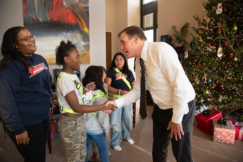 Dumfries Elementary School children hang Christmas decorations at Sen. Mark Warner's office