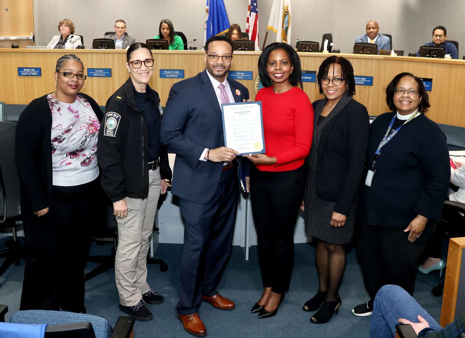 Sgt. Byron Jenkins and Chair At-large Deshundra Jefferson pictured in the center. [Photo: Prince William County Government]